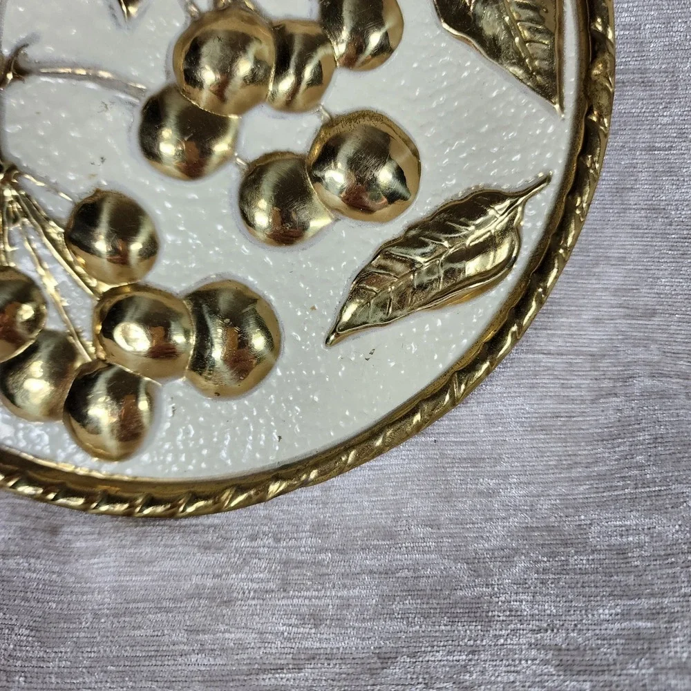 vintage embossed brass wall plaque with mid-century cherries made in Holland